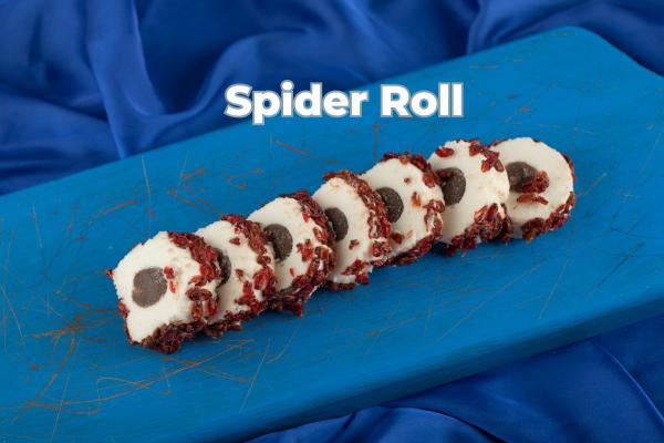 Spider Roll sushi on a blue cutting board with a blue fabric background.