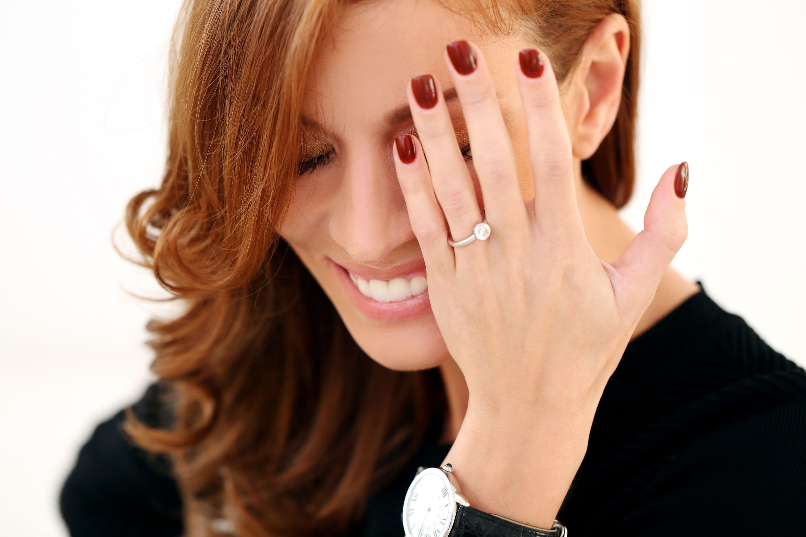 Close-up of a hand with perfect white shiny nails.